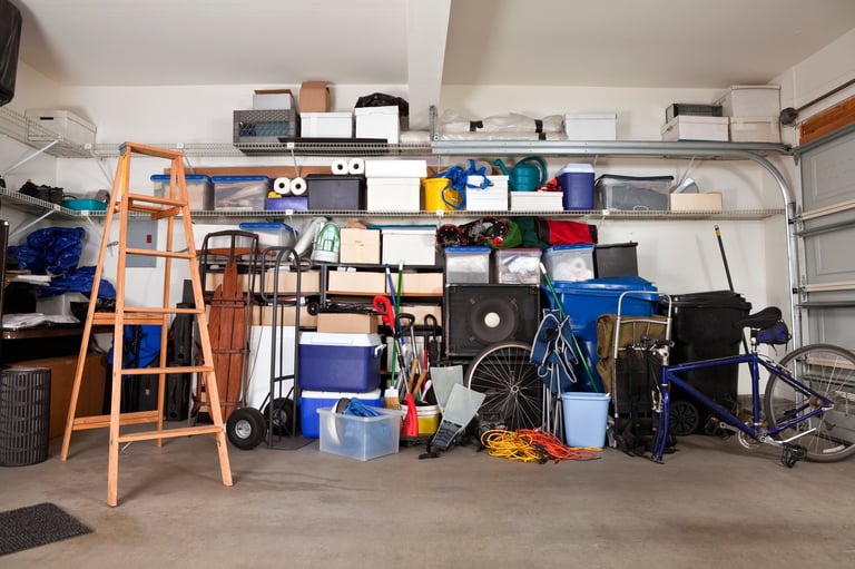 Before: Cluttered and disorganized garage with boxes and clutter everywhere