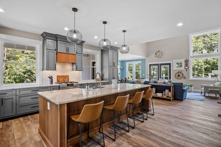 Beautiful modern kitchen with large island in new England colonial home